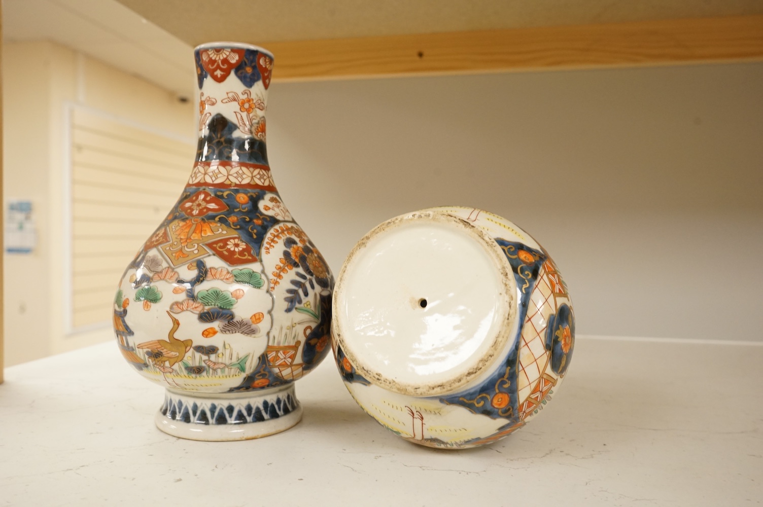 A pair of 19th century Japanese Imari bottle vases, 22cm high